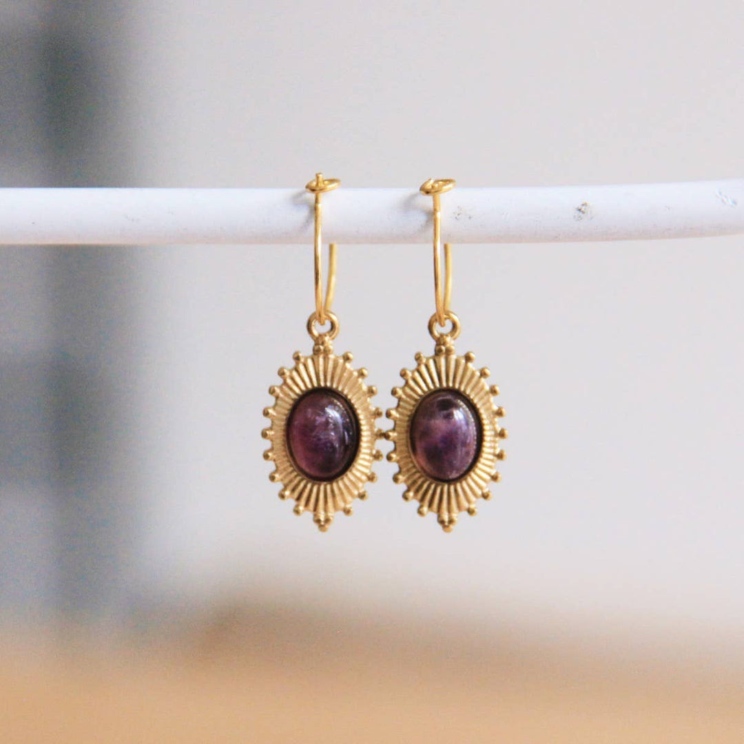 Oval earrings with purple stone