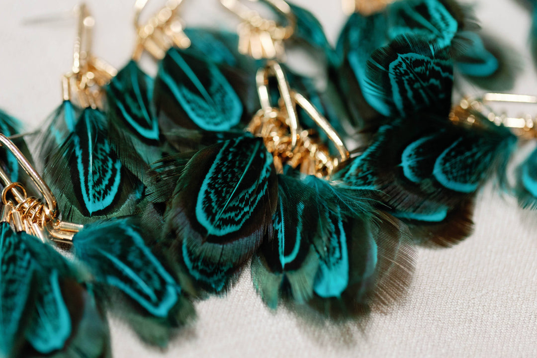 Earrings with peacock feathers and autumnal tassels
