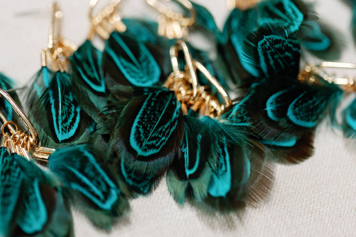 Earrings with peacock feathers and autumnal tassels