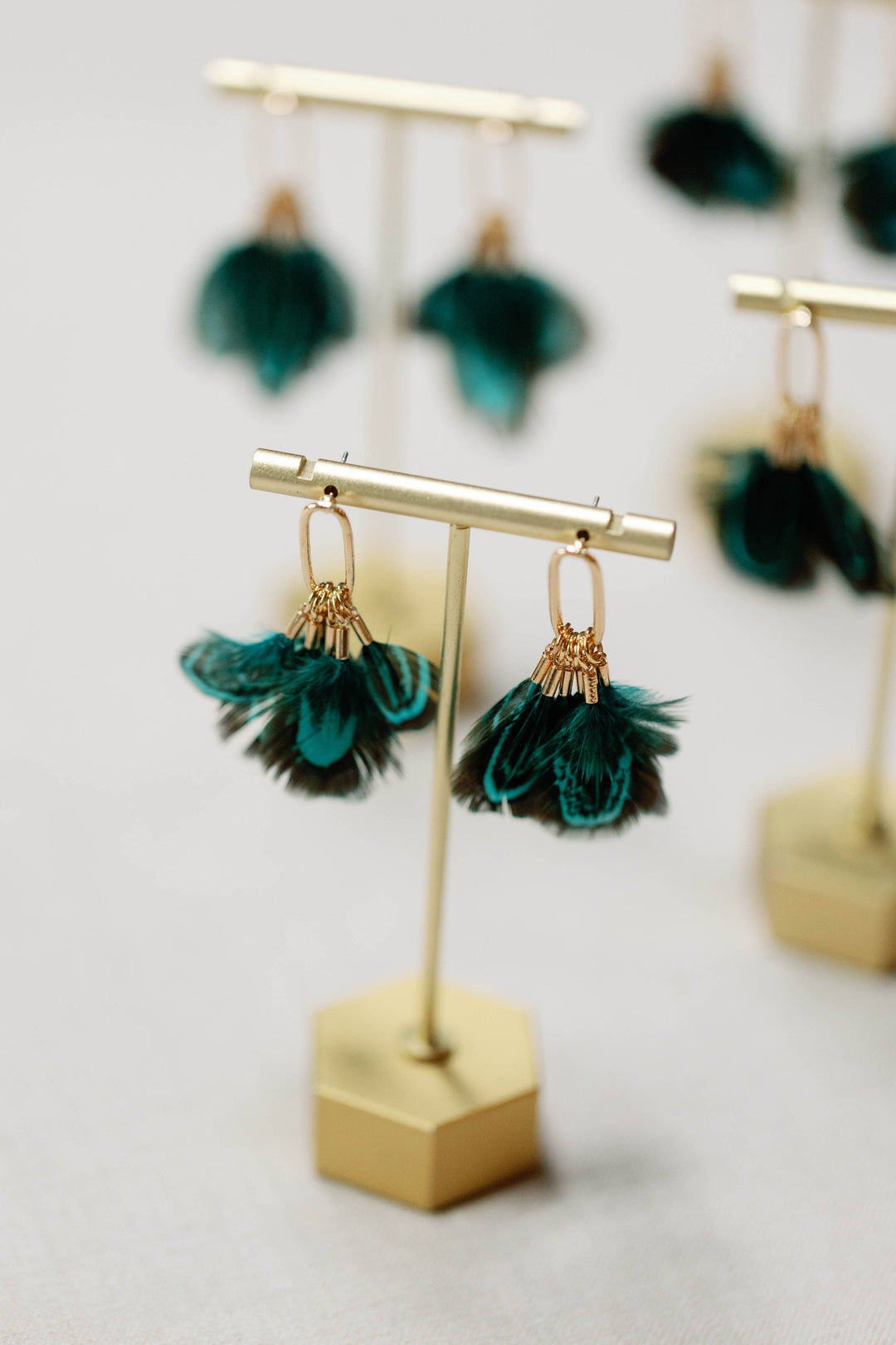 Earrings with peacock feathers and autumnal tassels