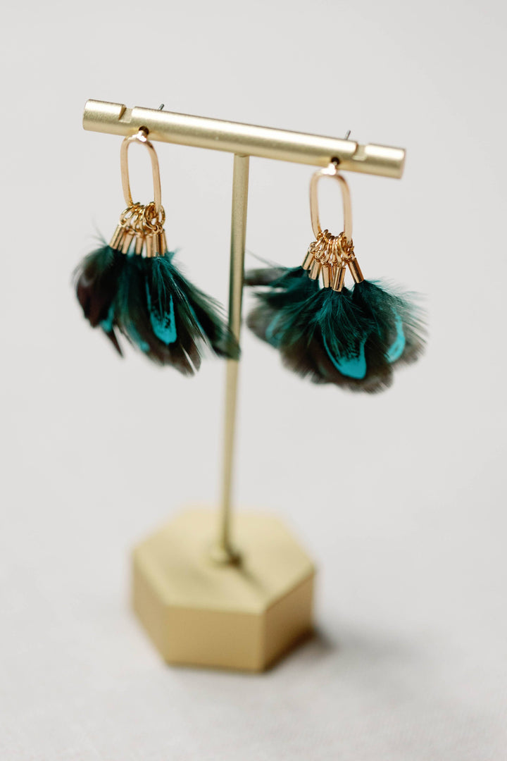 Earrings with peacock feathers and autumnal tassels