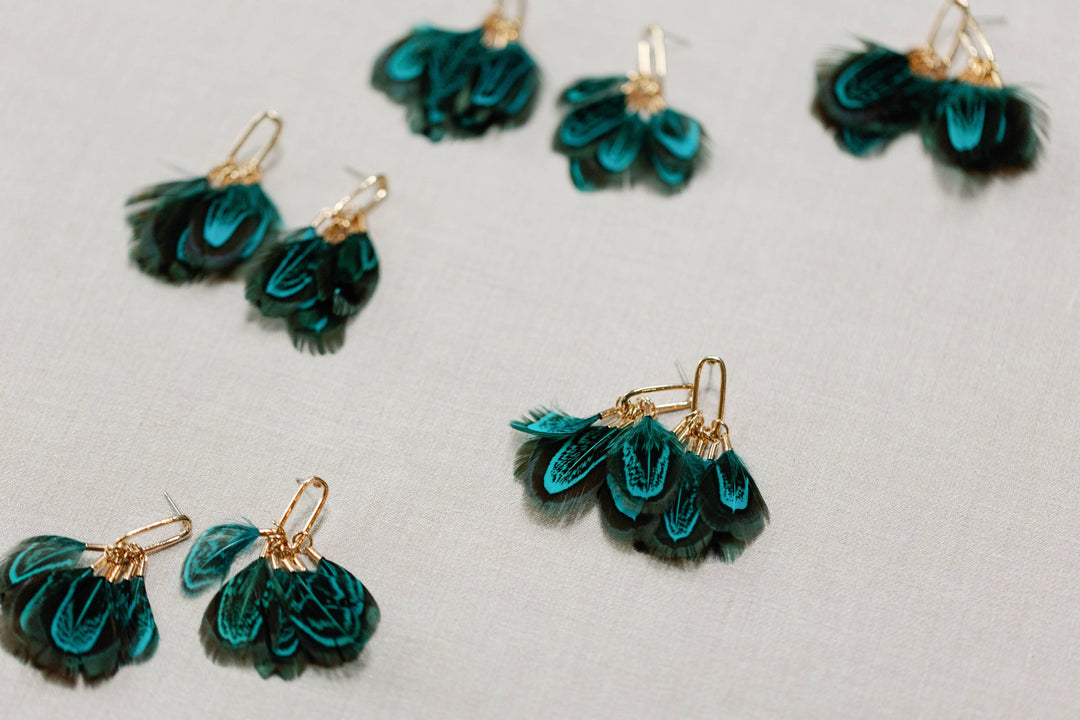 Earrings with peacock feathers and autumnal tassels