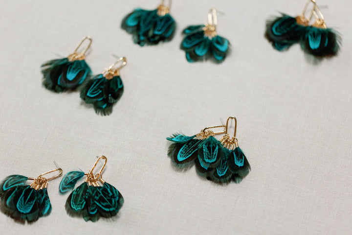 Earrings with peacock feathers and autumnal tassels