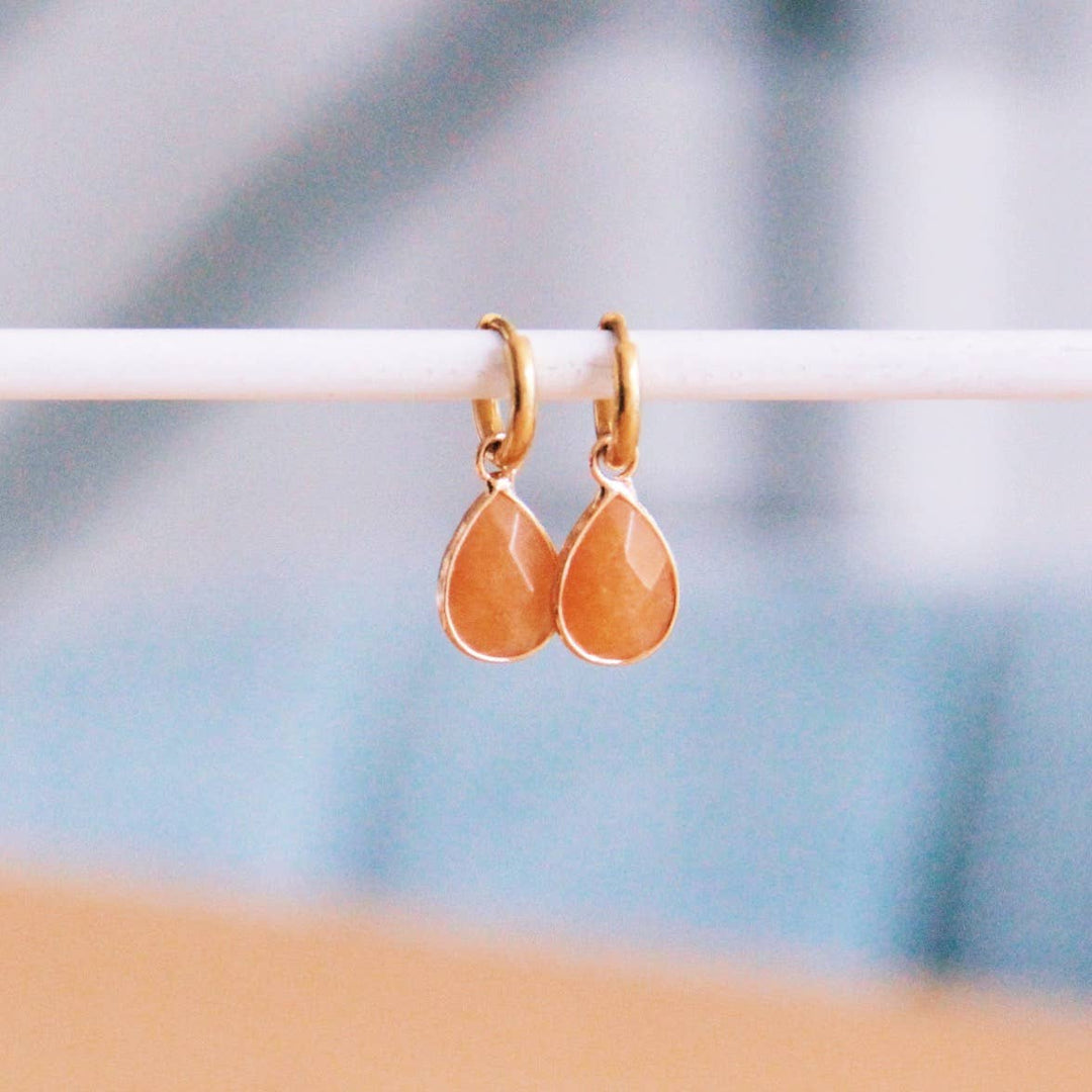 Hoops made of steel with drop-shaped natural stone — amber