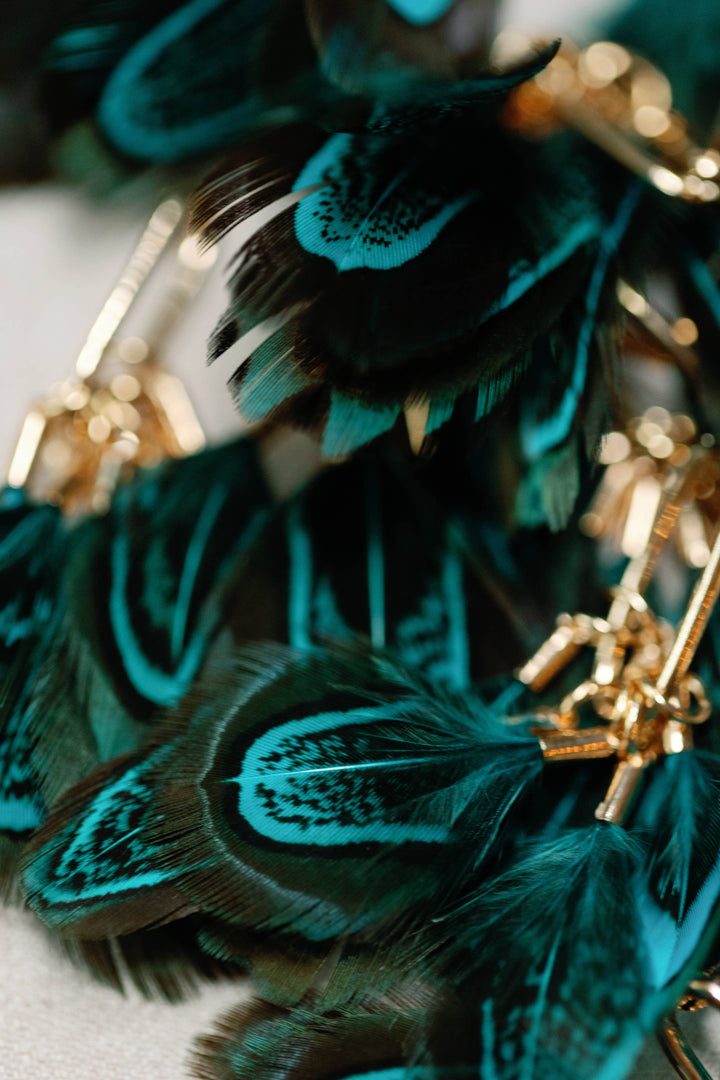Earrings with peacock feathers and autumnal tassels