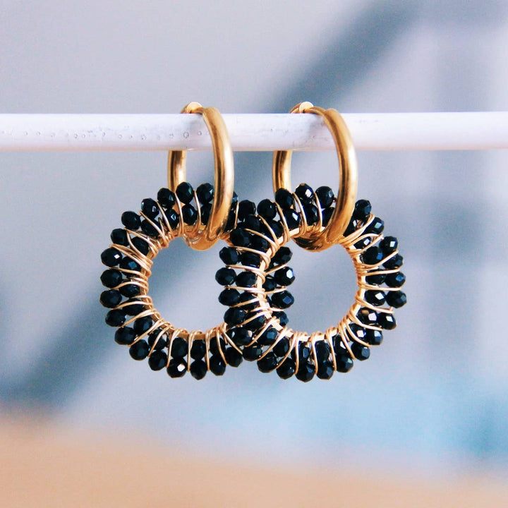 Stainless steel earring with round faceted pendant - black/gold