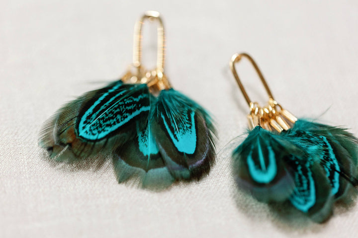 Earrings with peacock feathers and autumnal tassels
