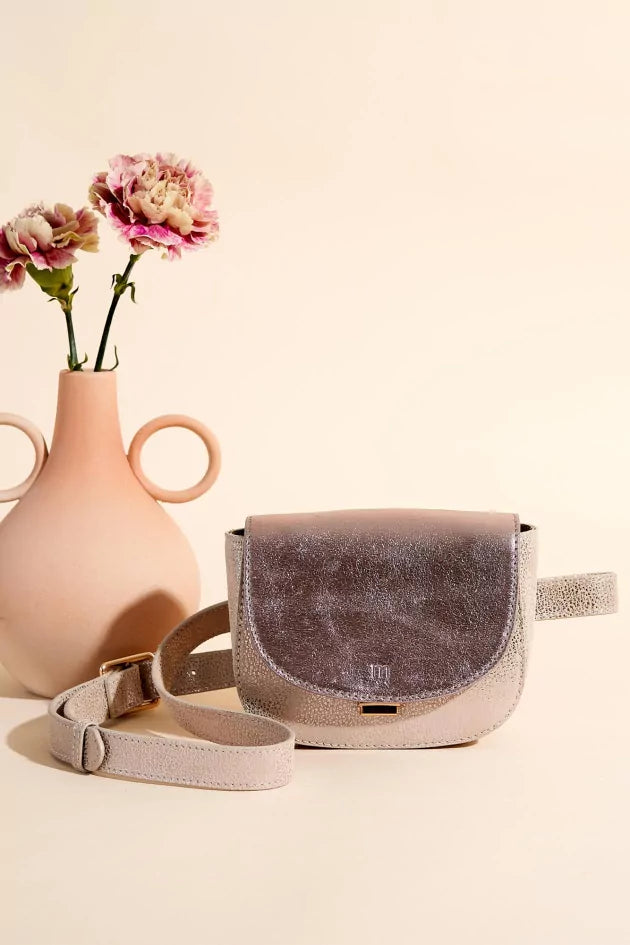 Angela Lila's metallic handbag