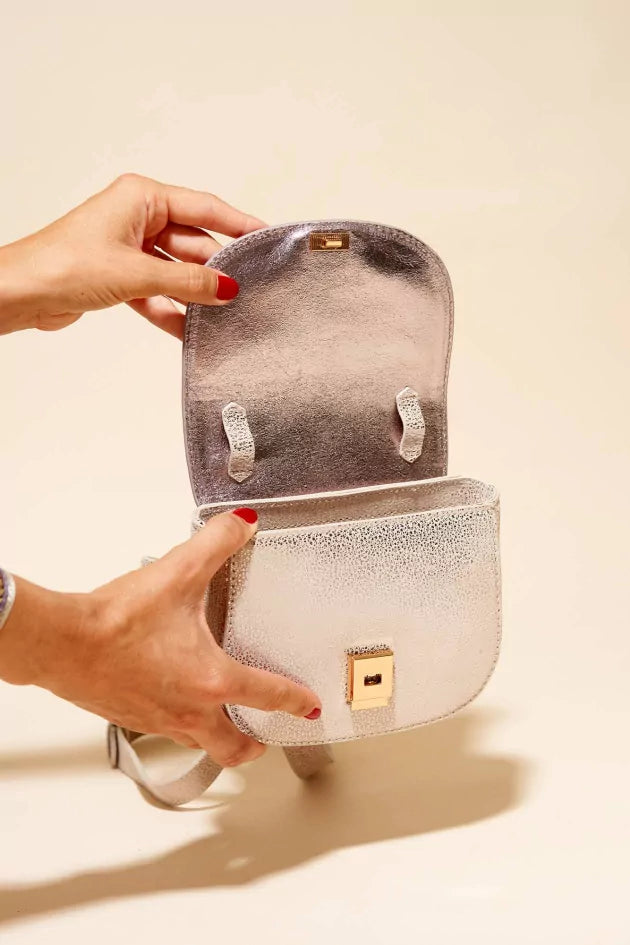 Angela Lila's metallic handbag
