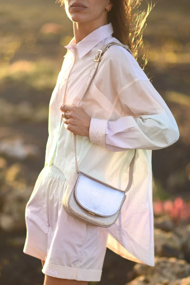 Angela Lila's metallic handbag