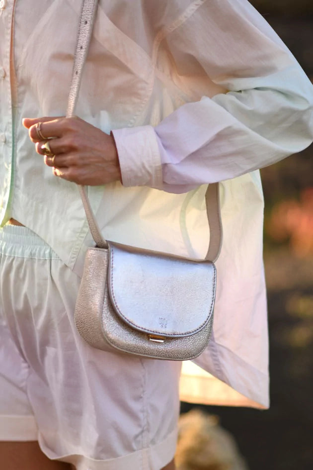 Angela Lila's metallic handbag